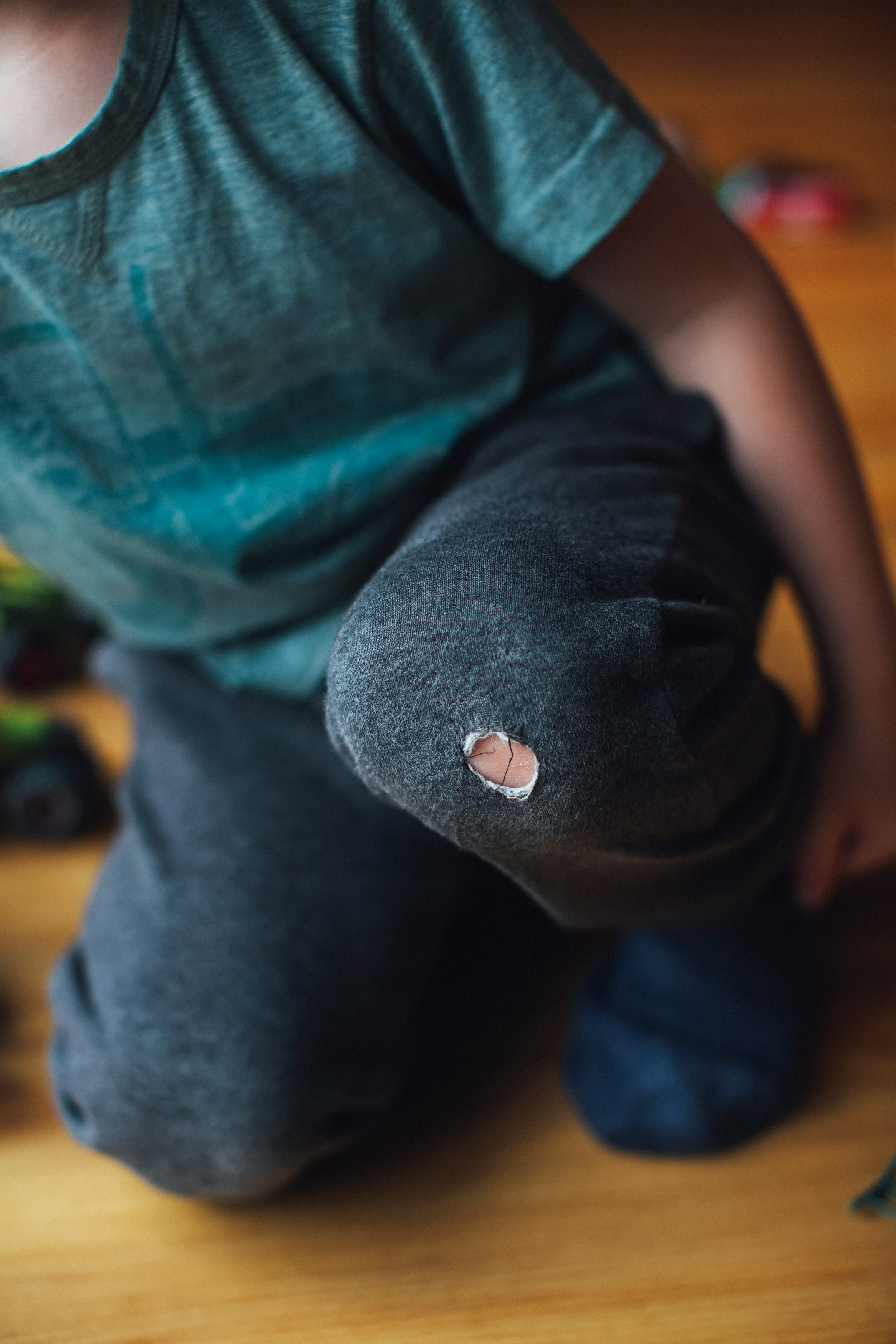 person in black shirt and blue denim jeans